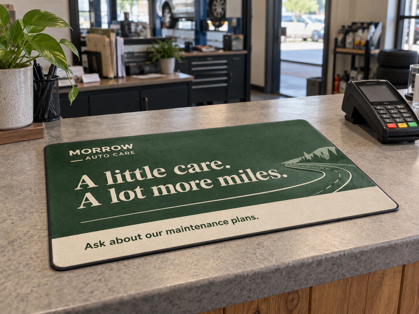 Illustration of a branded counter mat beside a payment terminal