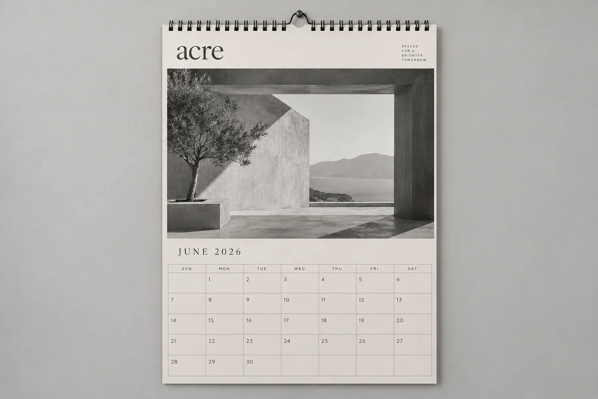 Acre calendars photographed on a soft neutral studio background